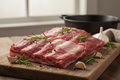 Grass-fed beef short ribs with herbs on wooden board