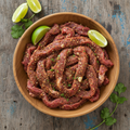 Seasoned fajita meat in bowl
